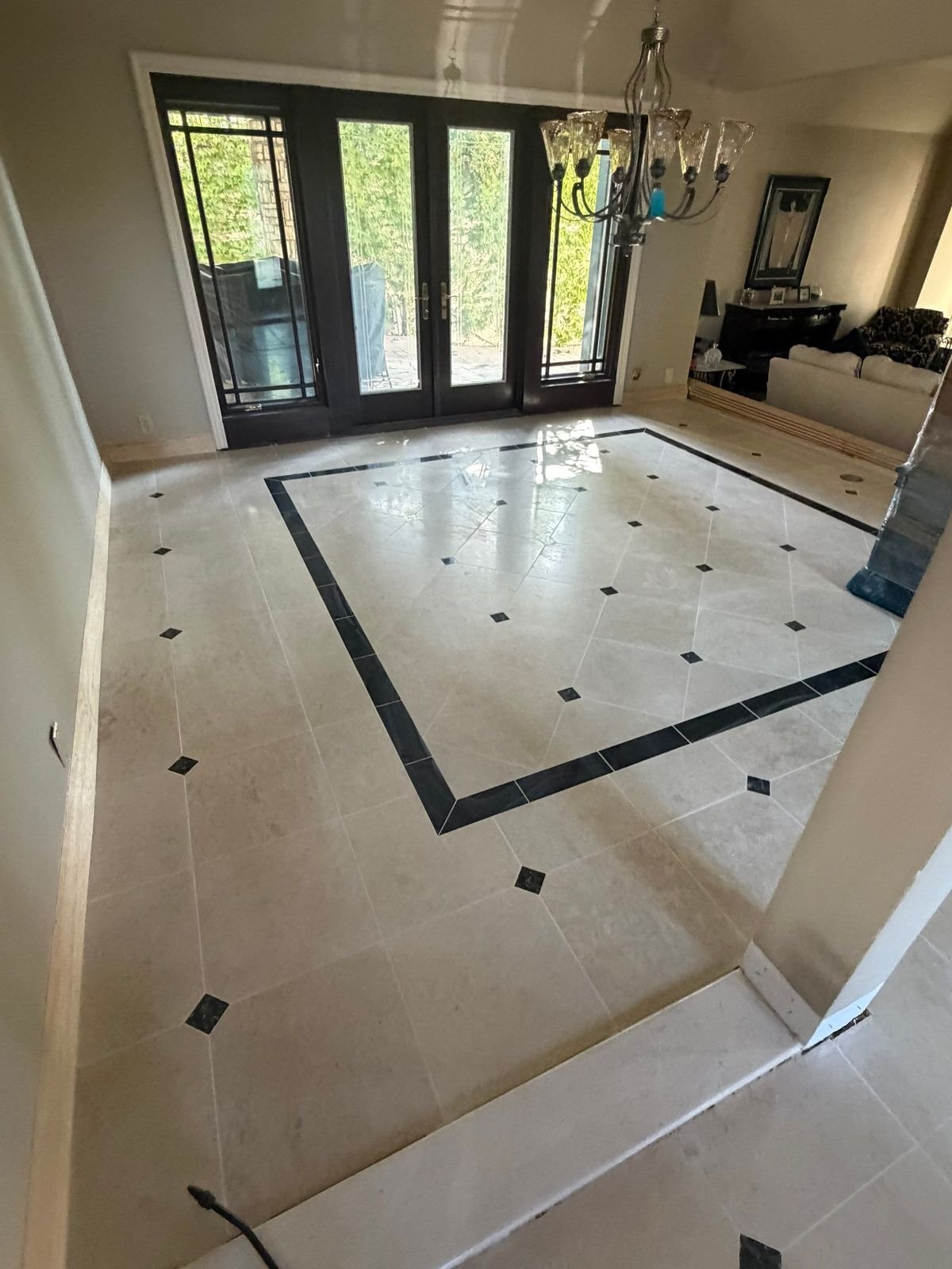 Limestone dining room floor with black border restored in Coto de Caza, CA
