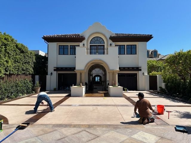 Crew sealing a stamped concrete motor court in Coto de Caza, CA