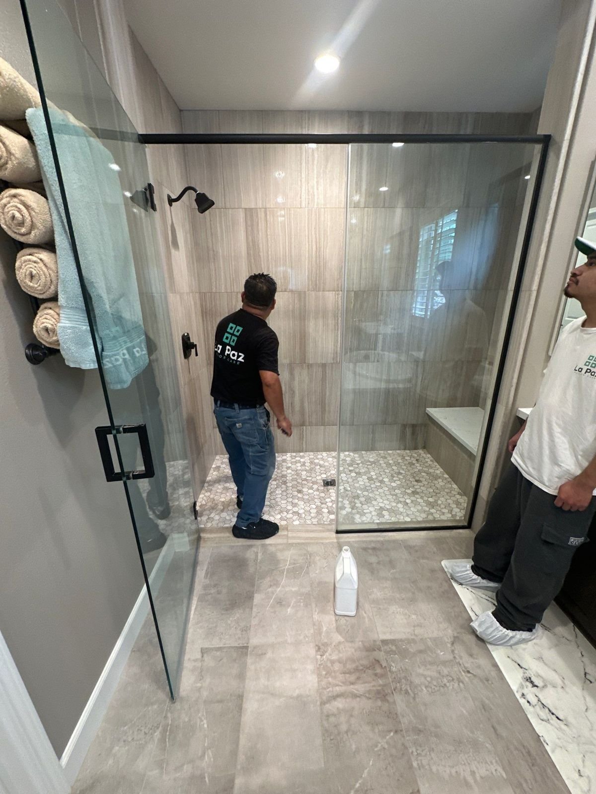 La Paz Floor Care crew restoring a stone shower in a Dana Point, CA home