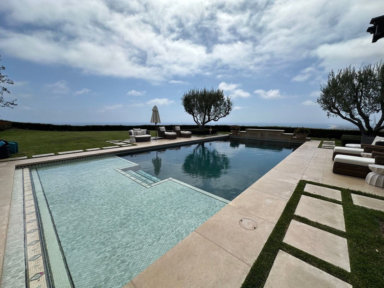 Limestone pool surround and stepping stones in Ladera Ranch, CA