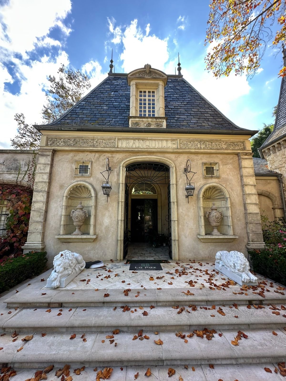 Limestone entry steps at a French-style estate with a La Paz Floor Care mat in Laguna Beach, CA