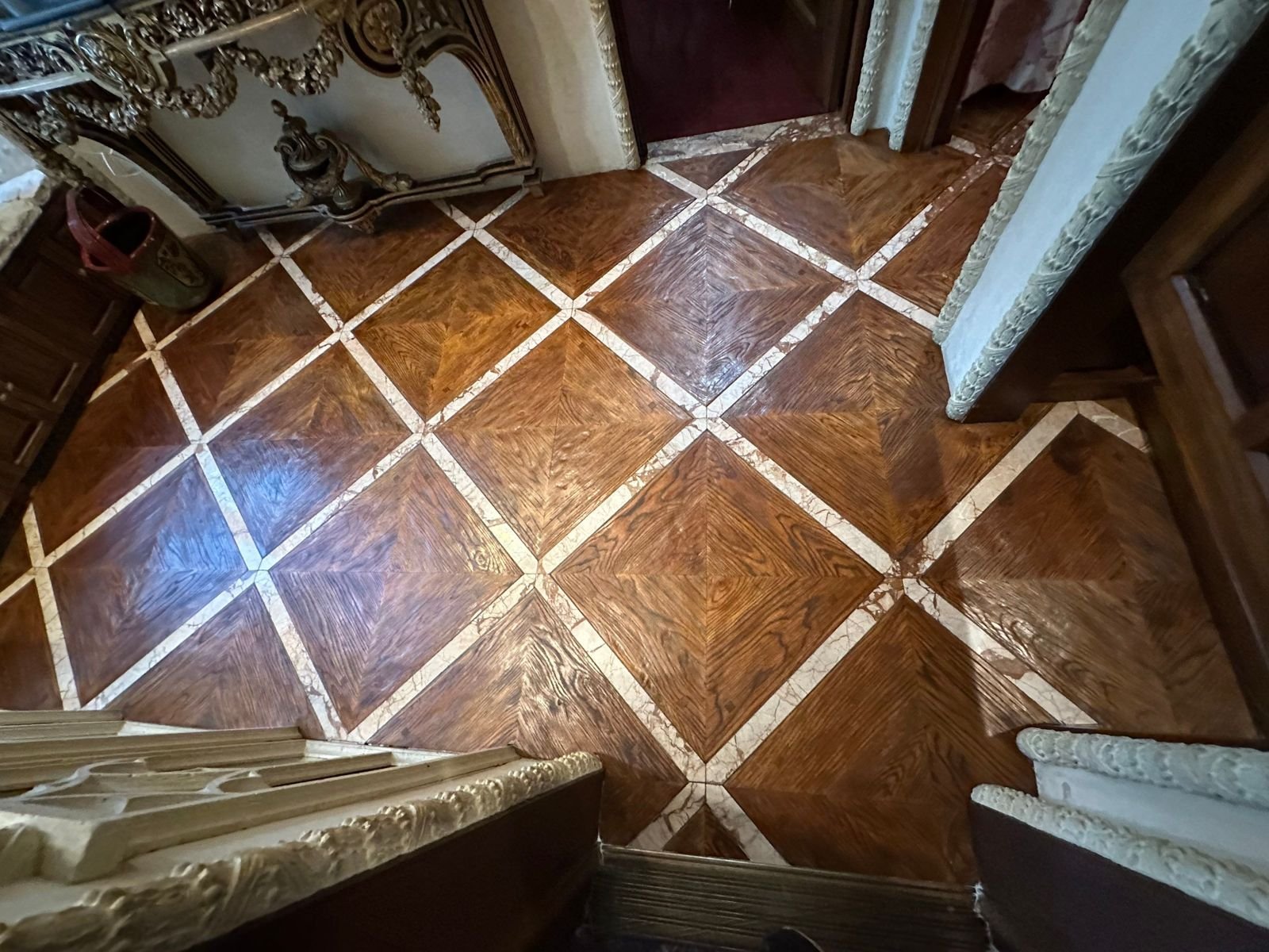 Oak parquet with marble banding restored in Laguna Beach, CA