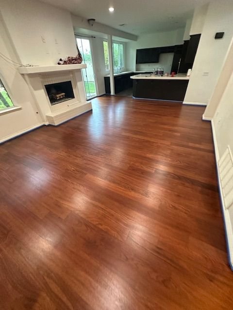 Hardwood floor refinished in a rich cherry tone in Laguna Hills, CA