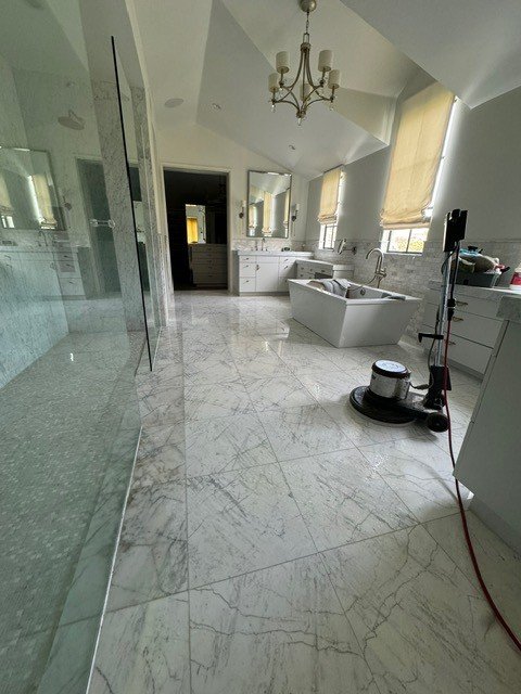 Marble master bath floor being polished in Laguna Niguel, CA